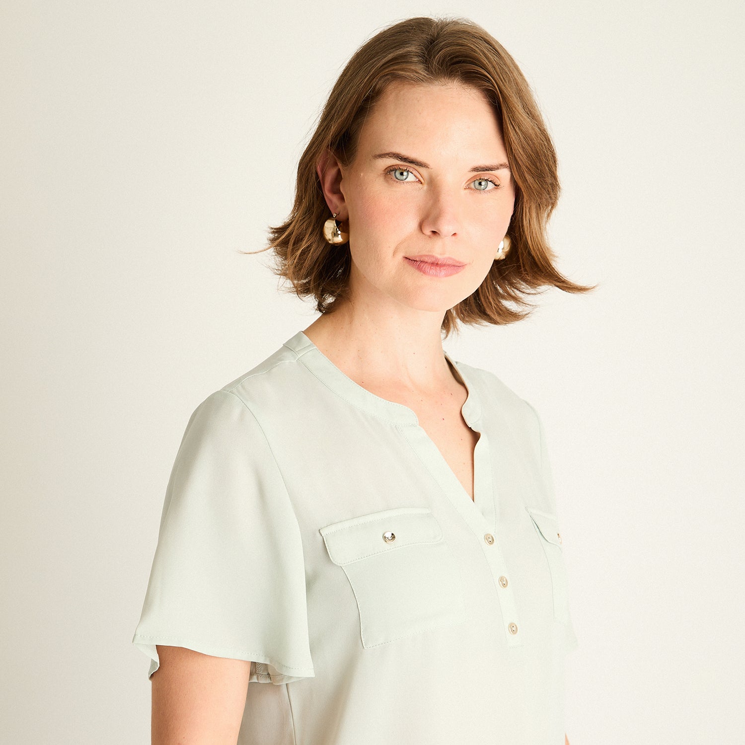 Blusa Menta con Bolsillos Frontales